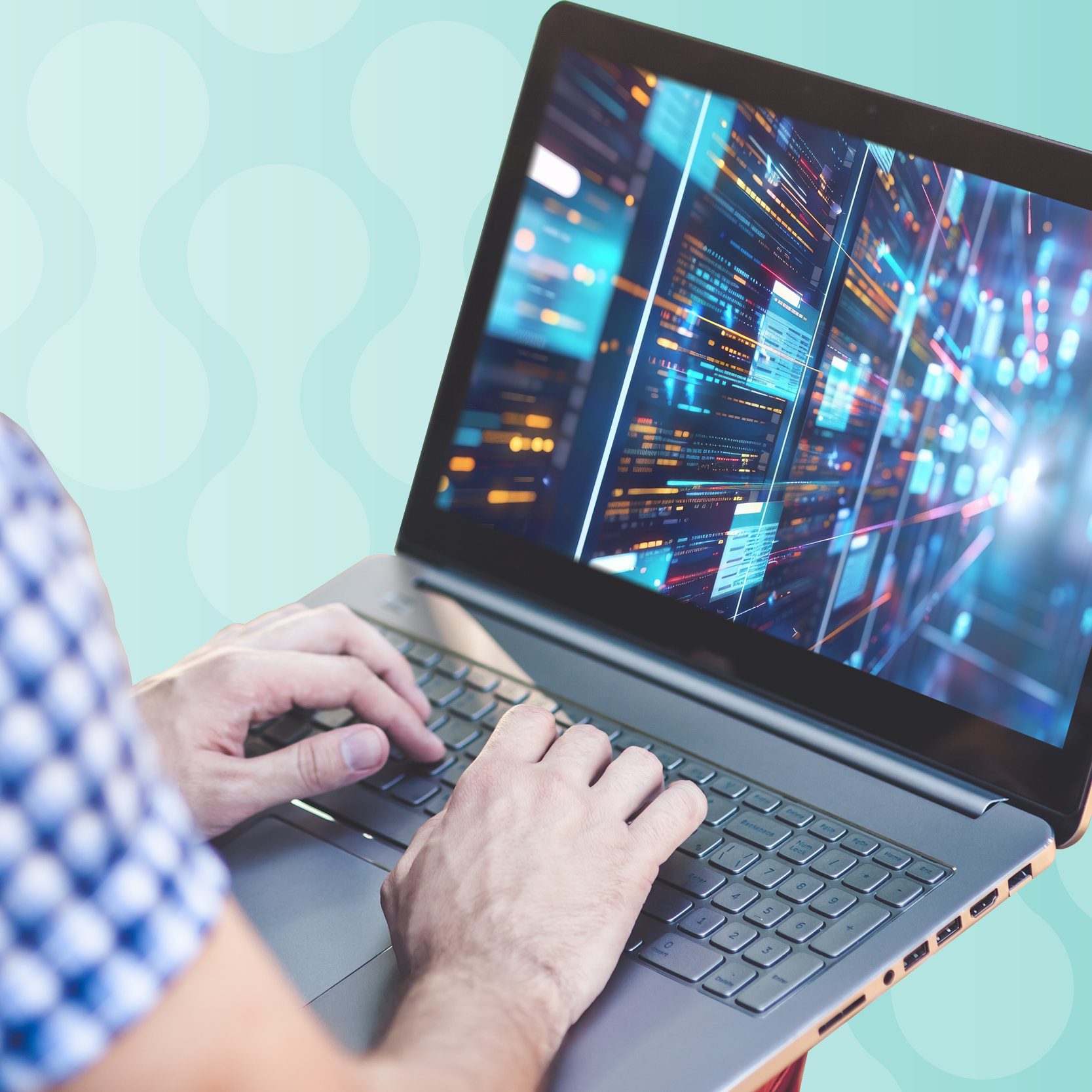 Person typing on laptop. Laptop screen depicts digital data.